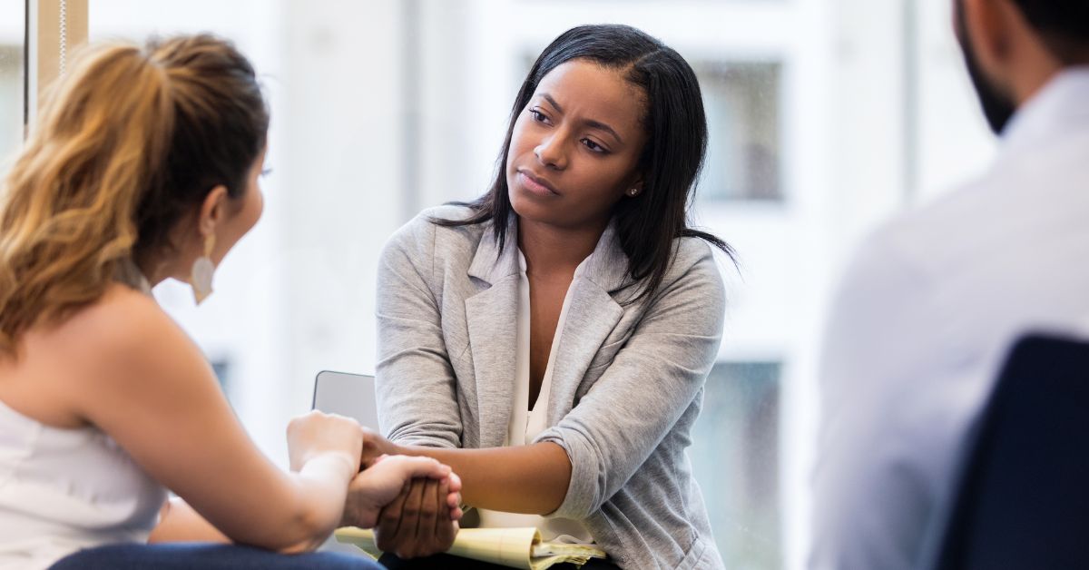 A woman is using trauma-informed care principles in counseling another woman.