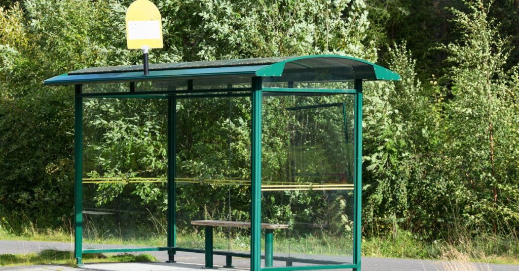 An empty bus stop shows a place where you would get telehealth in rural areas.